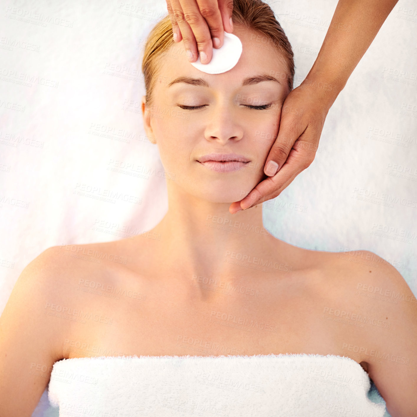 Buy stock photo Shot of a young woman getting a facial at a spa