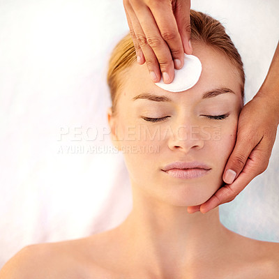 Buy stock photo Shot of a young woman getting a facial at a spa