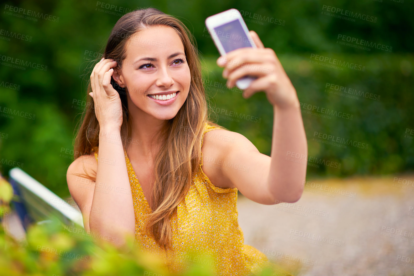 Buy stock photo Outdoor, relax and woman with selfie in park for memory, photograph or social media post. Nature, smile and female person on bench for happiness, profile picture or peaceful weekend in garden