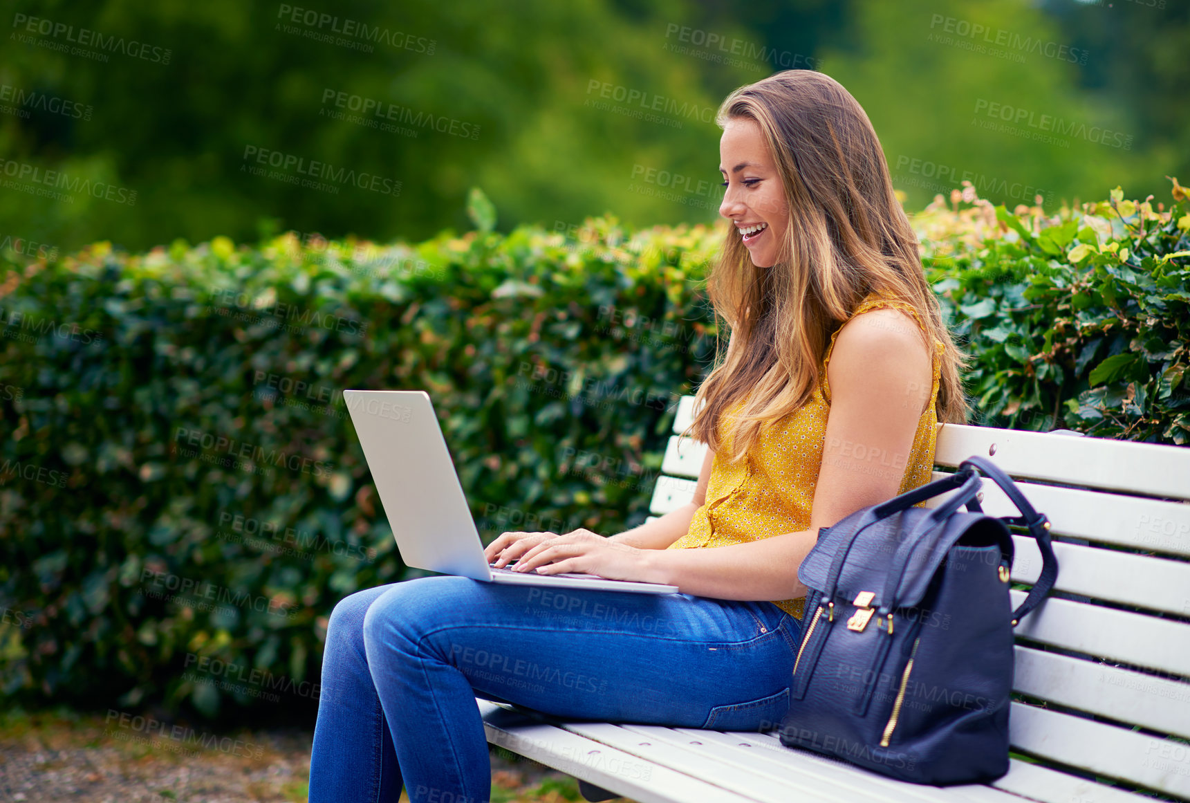 Buy stock photo Woman, park and happy on laptop as university student with assignment or essay in New York. Female person, gen z and smile in garden with online research on website for college task or project