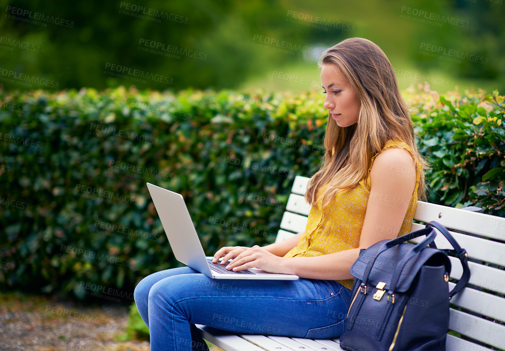 Buy stock photo Woman, park and typing on laptop as university student with assignment or essay in New York. Female person, elearning and break in garden with online research on website for college task or project