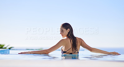 Buy stock photo Shot of a young woman in a swimming pool