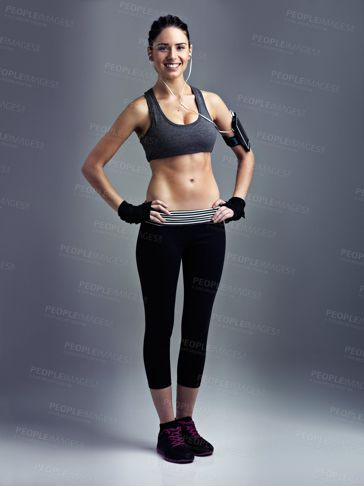 Buy stock photo Studio shot of a sporty young woman against a gray background