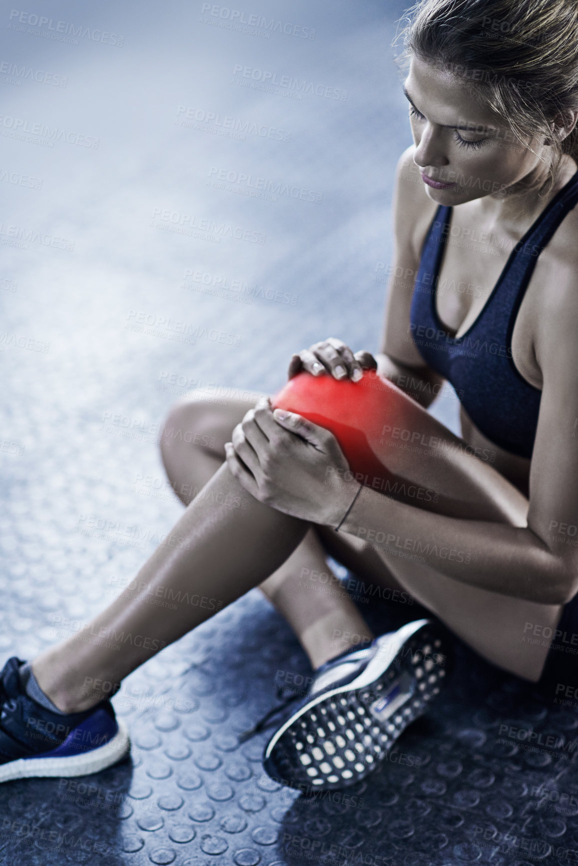 Buy stock photo Woman, knee injury and pain with red glow for accident or bruise in fitness, workout or exercise on gym floor. Frustrated female person with sore ache, bone or inflammation for hurt joint or muscle