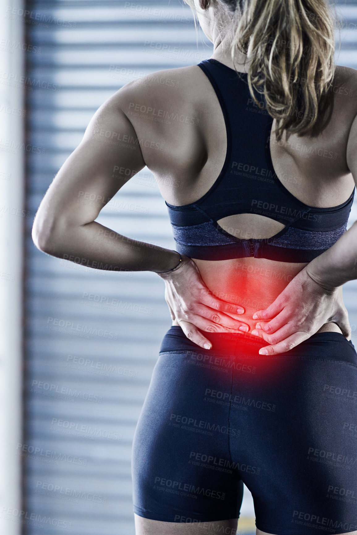 Buy stock photo Woman, fitness and back pain with injury or red glow for accident or bruise after workout or exercise at gym. Rear view of female person with sore spine, ache or inflammation for hurt joint or muscle