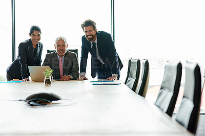 Buy stock photo Group of businesspeople planning an innovation project together as a team in a meeting in a modern boardroom office. Portrait of professional executives happy and smiling about a strategy idea