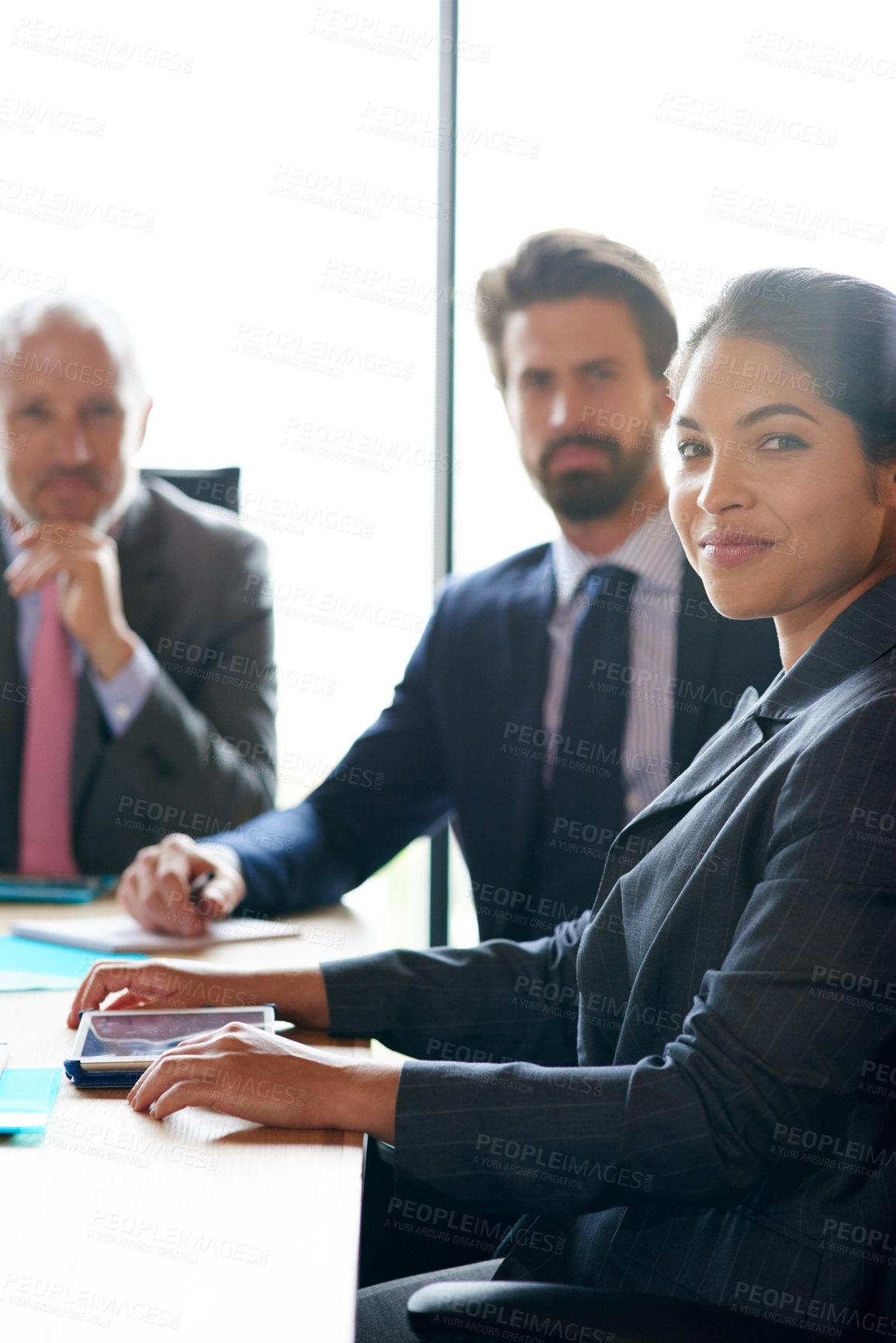 Buy stock photo Confident, corporate and motivated businesspeople sitting together in a boardroom during a meeting. Great leadership and teamwork in an office. Portrait of a female entrepreneur and executives