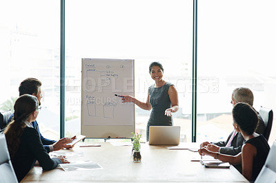 Buy stock photo Shot of a group of executives having a meeting in a boardroom