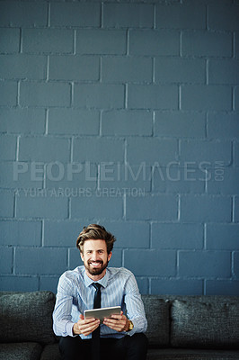 Buy stock photo Portrait of a businessman using a digital tablet