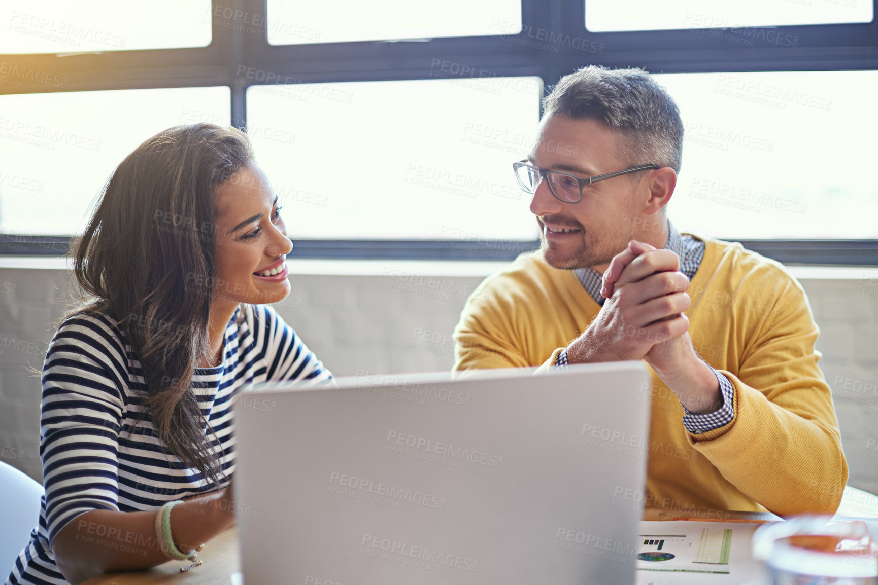 Buy stock photo Business people, consulting and meeting with laptop in office for IT project, review and feedback. Happy, manager and employee with tech at desk for software development, solution and progress update