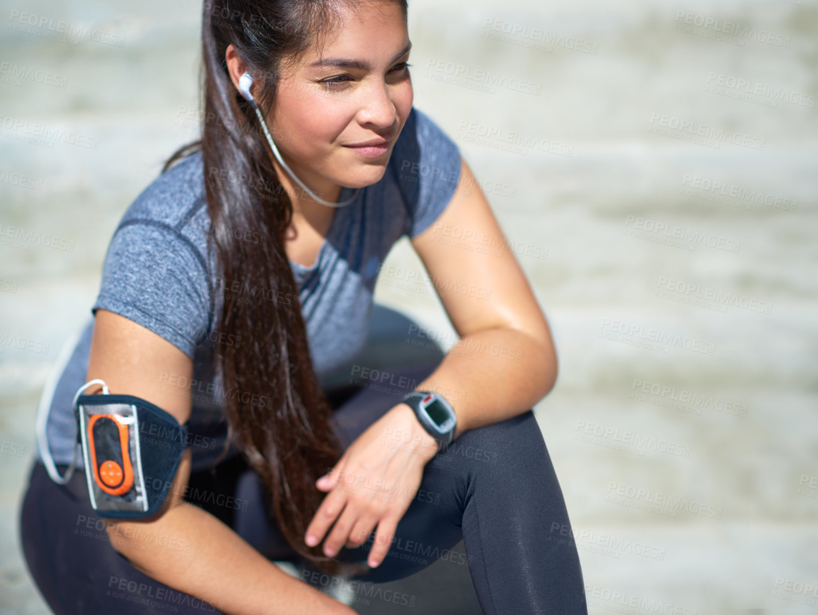 Buy stock photo Happy woman, fitness and break with earphones for music, relax or recovery on stairs in city. Female person with smile or headphones on stairs for podcast, playlist or audio after workout or exercise