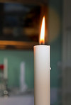 A photo of a candle in the dark