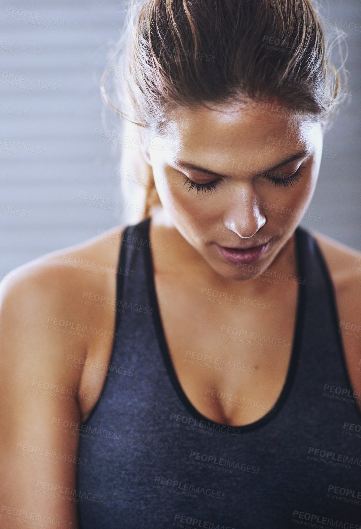 Buy stock photo Cropped shot of a fit young woman at the gym