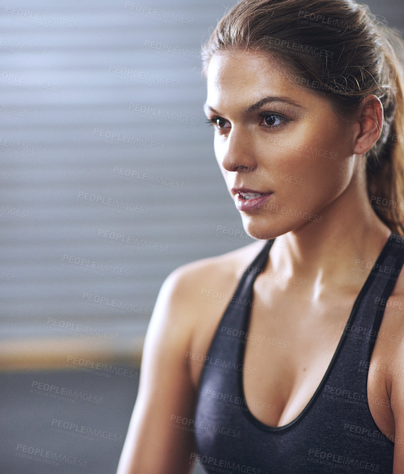 Buy stock photo Cropped shot of a fit young woman at the gym