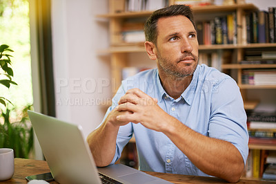 Buy stock photo Shot of a young man working from home