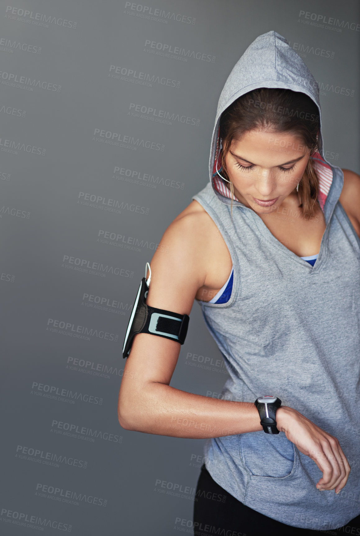 Buy stock photo Woman, watch and check for heart rate, wellness and fitness progress with health app and program. Music, blood pressure and workout with training and exercise in a studio with time `and headphones