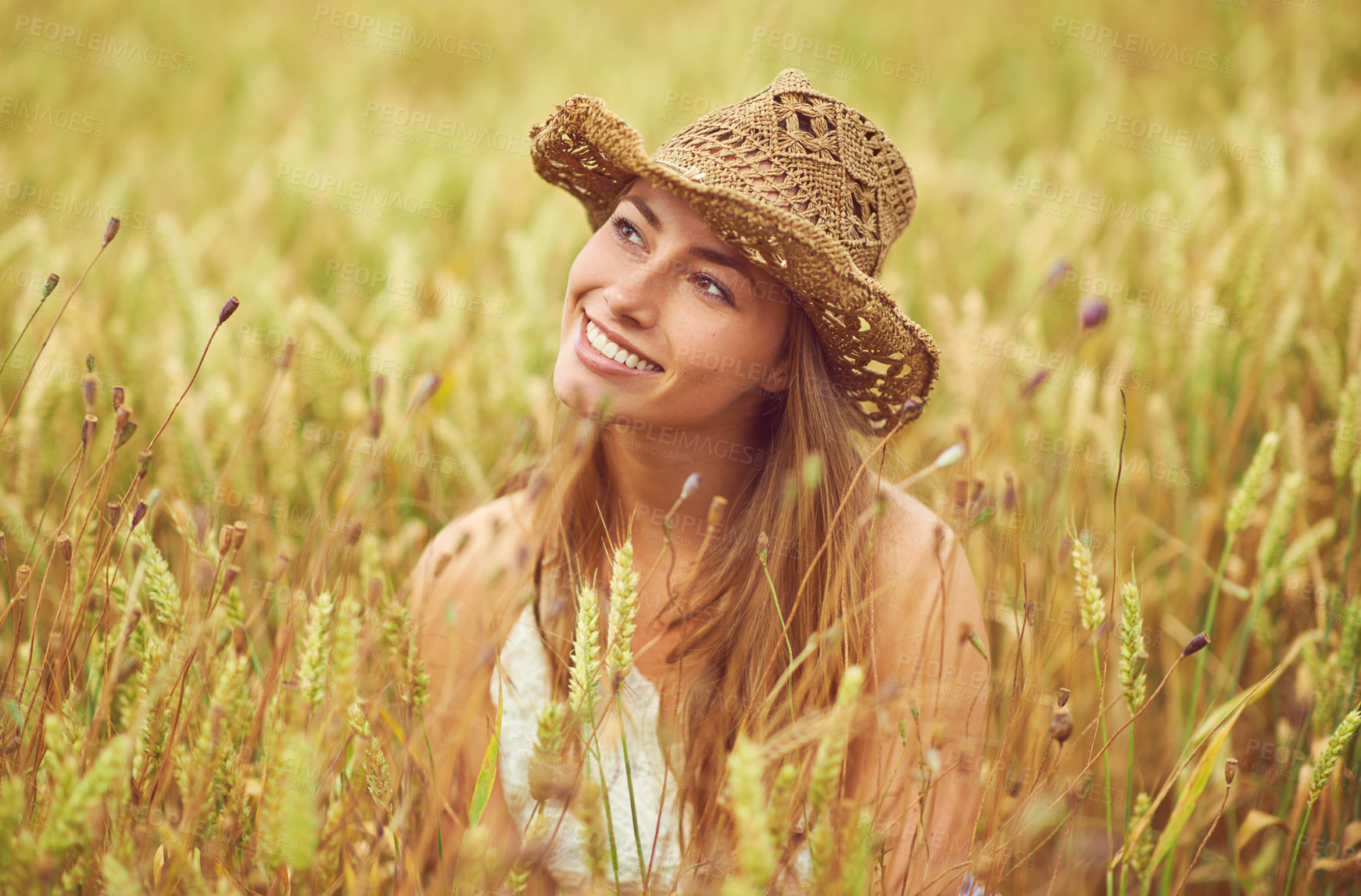 Buy stock photo Happy, woman and thinking in wheat farm for peace, growth and environment care in nature. Smile, relax and person in grain field for agriculture, calm and positive mental health in summer with hat