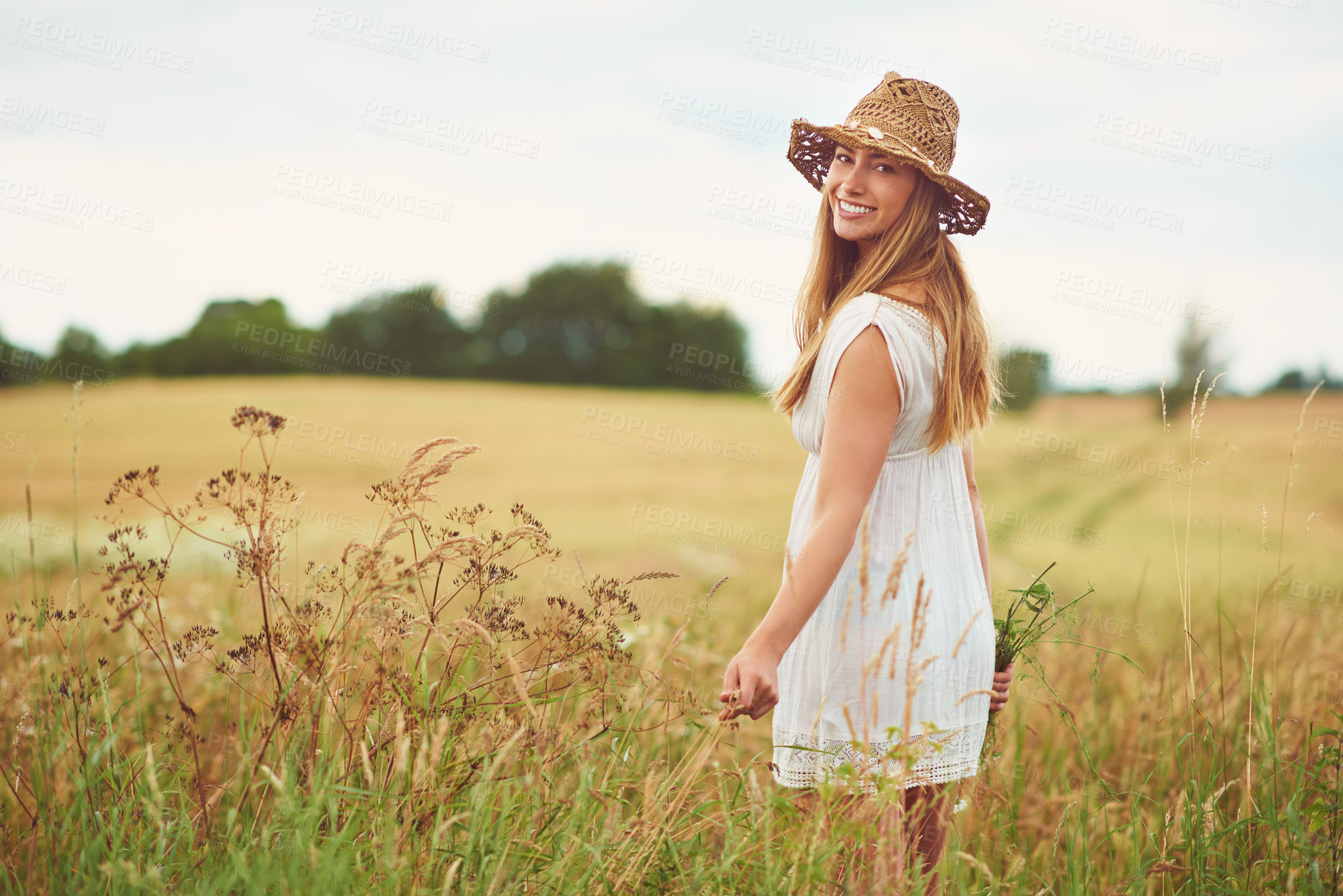 Buy stock photo Back, portrait and smile with woman in nature for break, travel or wellness in fashion season of summer. Organic hat, sky and sustainability with happy person outdoor of eco friendly style in meadow