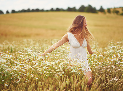 Buy stock photo Countryside, dancing and woman with flowers, outdoor and fun in nature and smile with energy. Grass, freedom and fresh air in forest, peace and holiday for person, relax and vacation in Australia