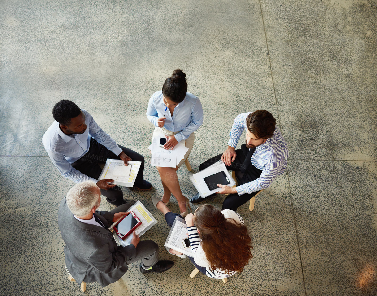 Buy stock photo Top view, business people and conversation in meeting, teamwork and cooperation with brainstorming. Group, staff and employees with documents, technology and planning with project and collaboration