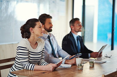 Buy stock photo Shot of a group of colleagues listening to a presentation in an office