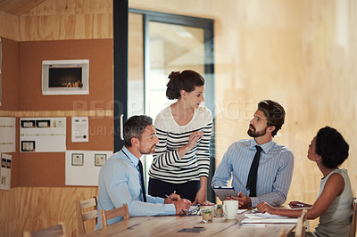 Buy stock photo Shot of a group of colleagues working together in an office