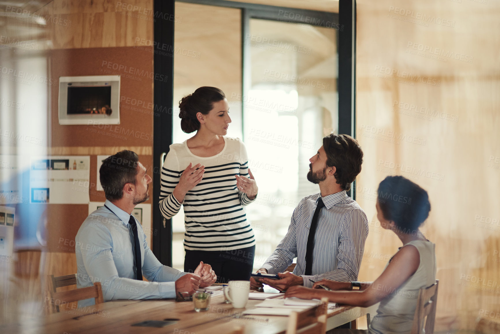 Buy stock photo Shot of a group of colleagues working together in an office