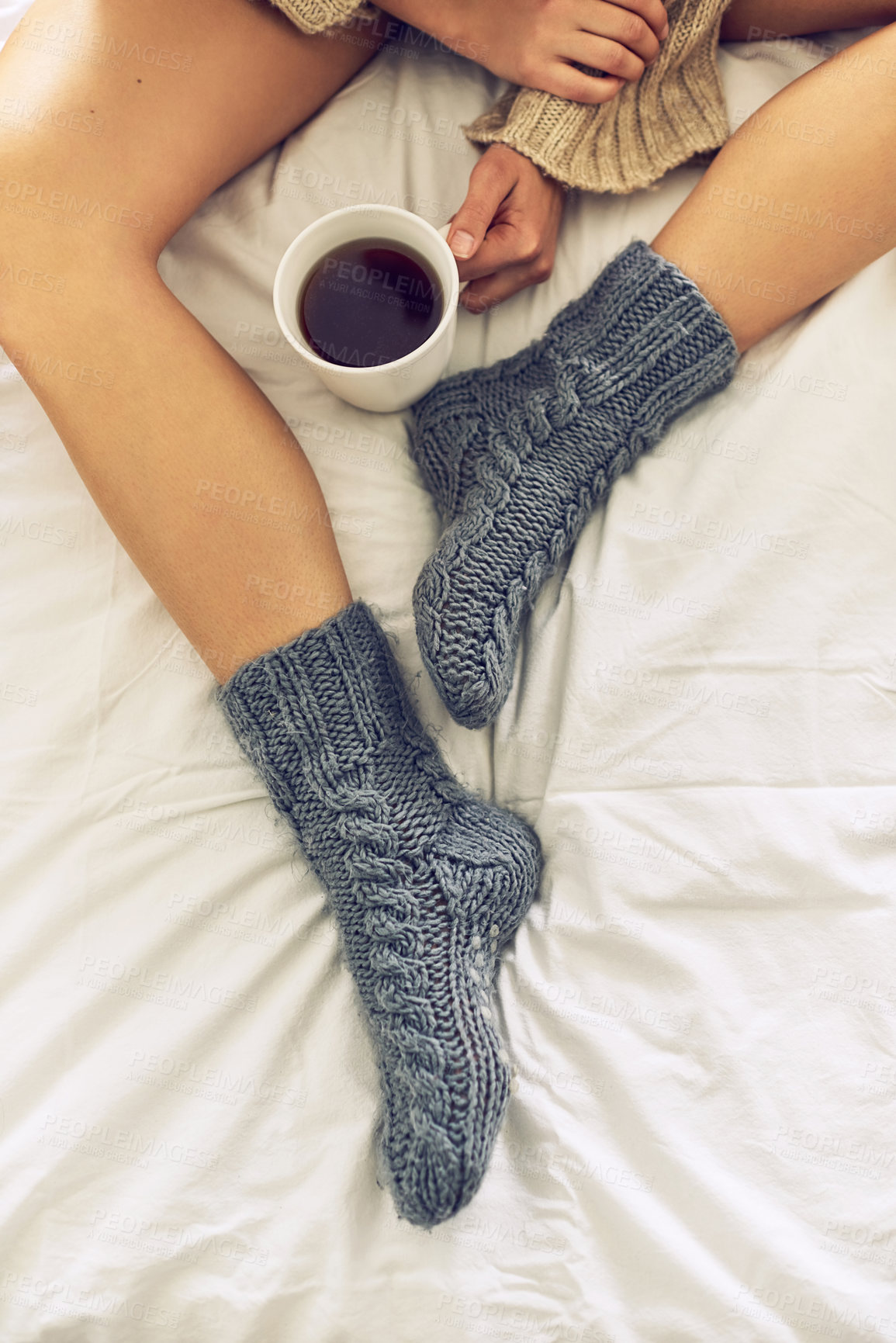 Buy stock photo Cropped shot of woman drinking a cup of coffee at home