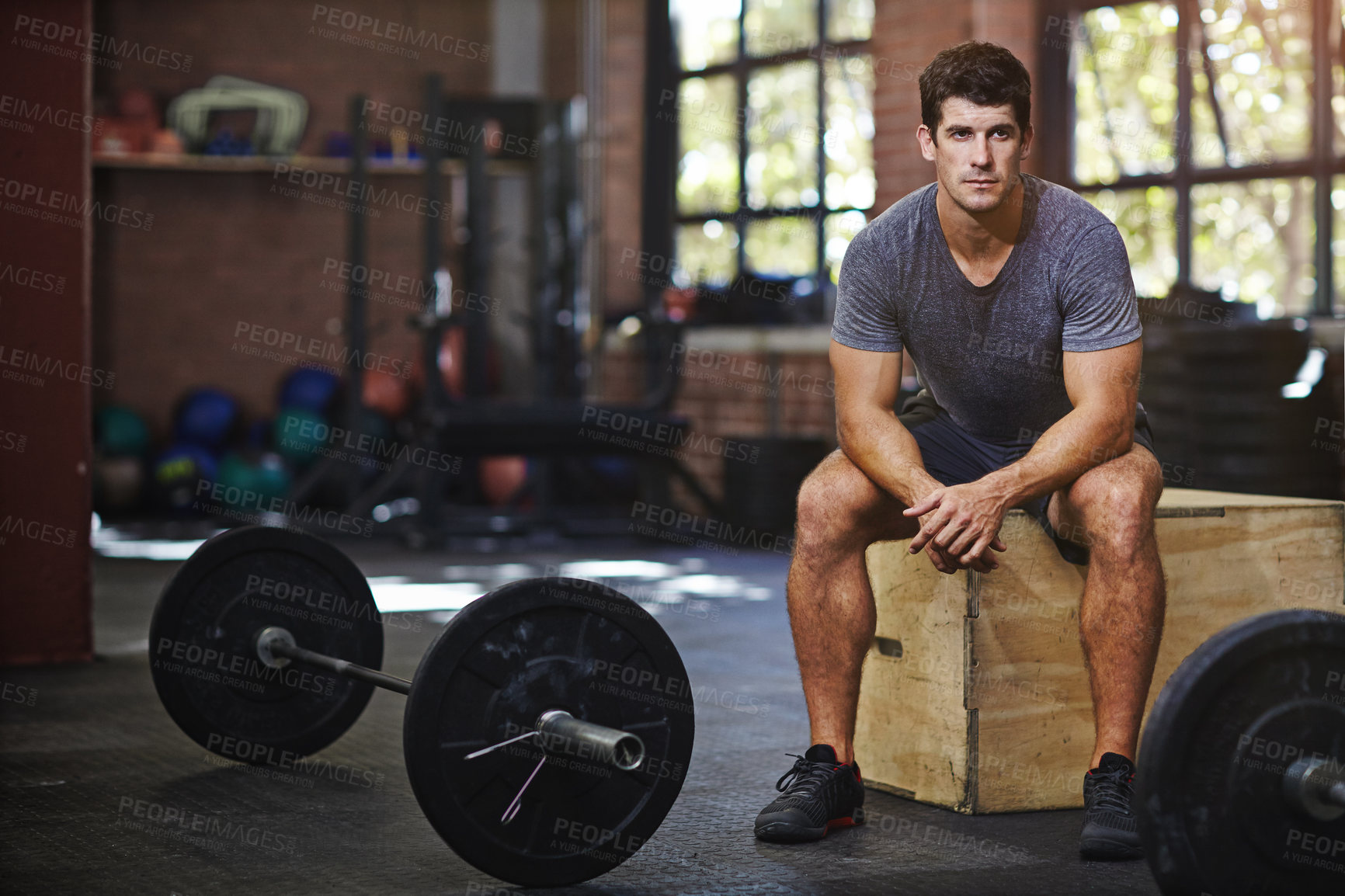 Buy stock photo Portrait of a young man taking a break from working out in a gym