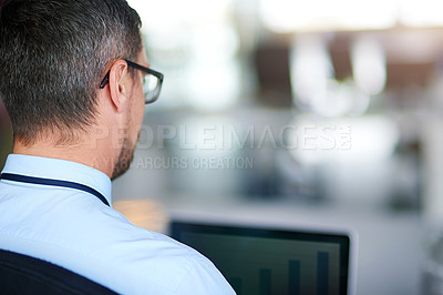 Buy stock photo Shot of a businessman working in an office