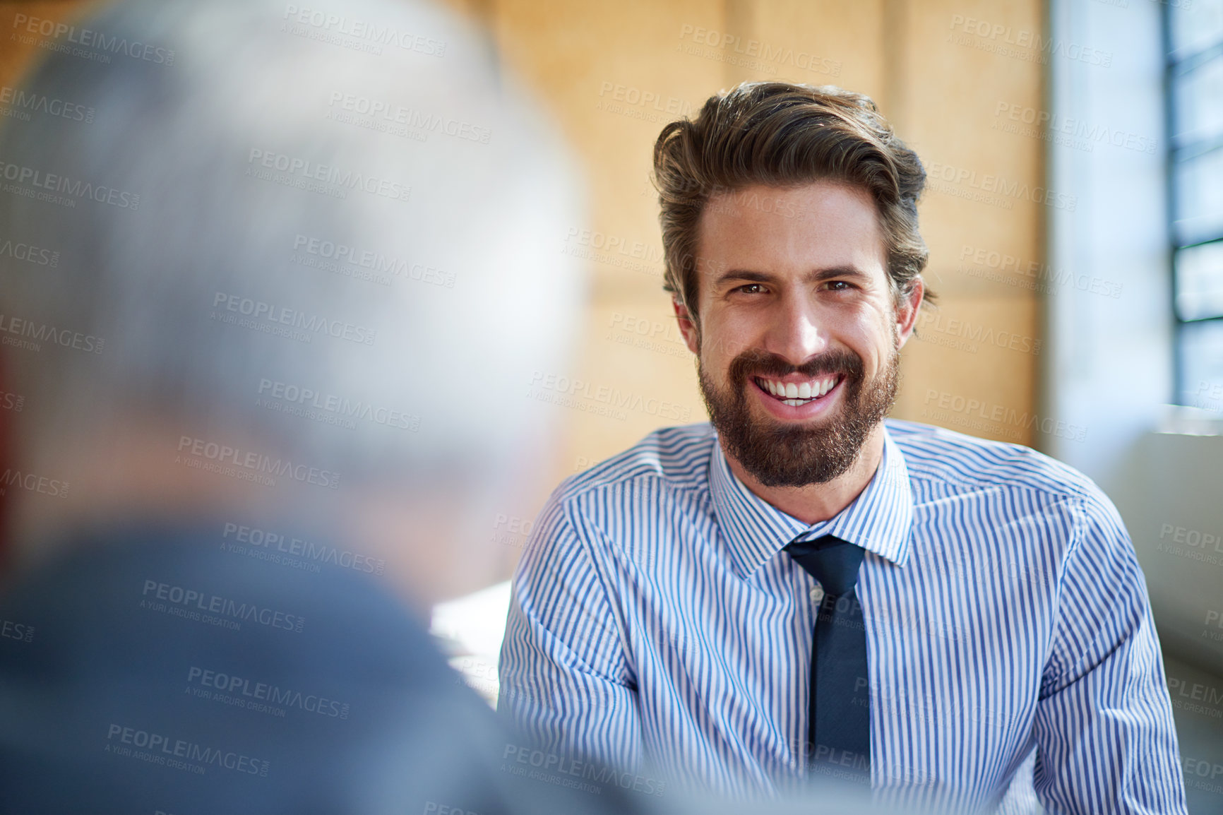 Buy stock photo Cropped shot of two businessmen talking in the office