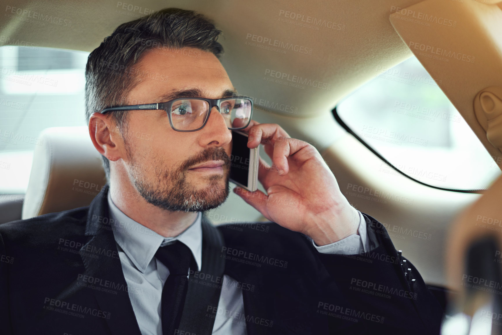 Buy stock photo Business man, phone call and thinking in car for travel, networking or decision for company. Person, vehicle and smartphone on ride, transportation and listen with chat in negotiation for agreement