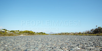 Buy stock photo Gravel, countryside and road with nature for trip, drive and travel on holiday in Kenya. Outdoor, adventure and asphalt closeup for transport, highway and vacation for journey in rural areas