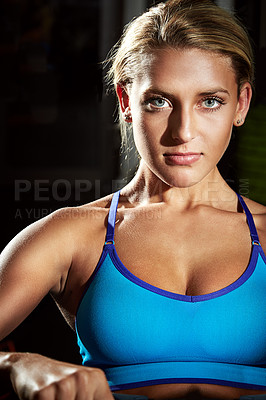 Buy stock photo Shot of a young woman working out in the studio