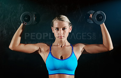 Buy stock photo Portrait of a young woman working out with weights