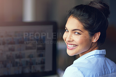 Buy stock photo Cropped portrait of a young businesswoman sitting at her office computer