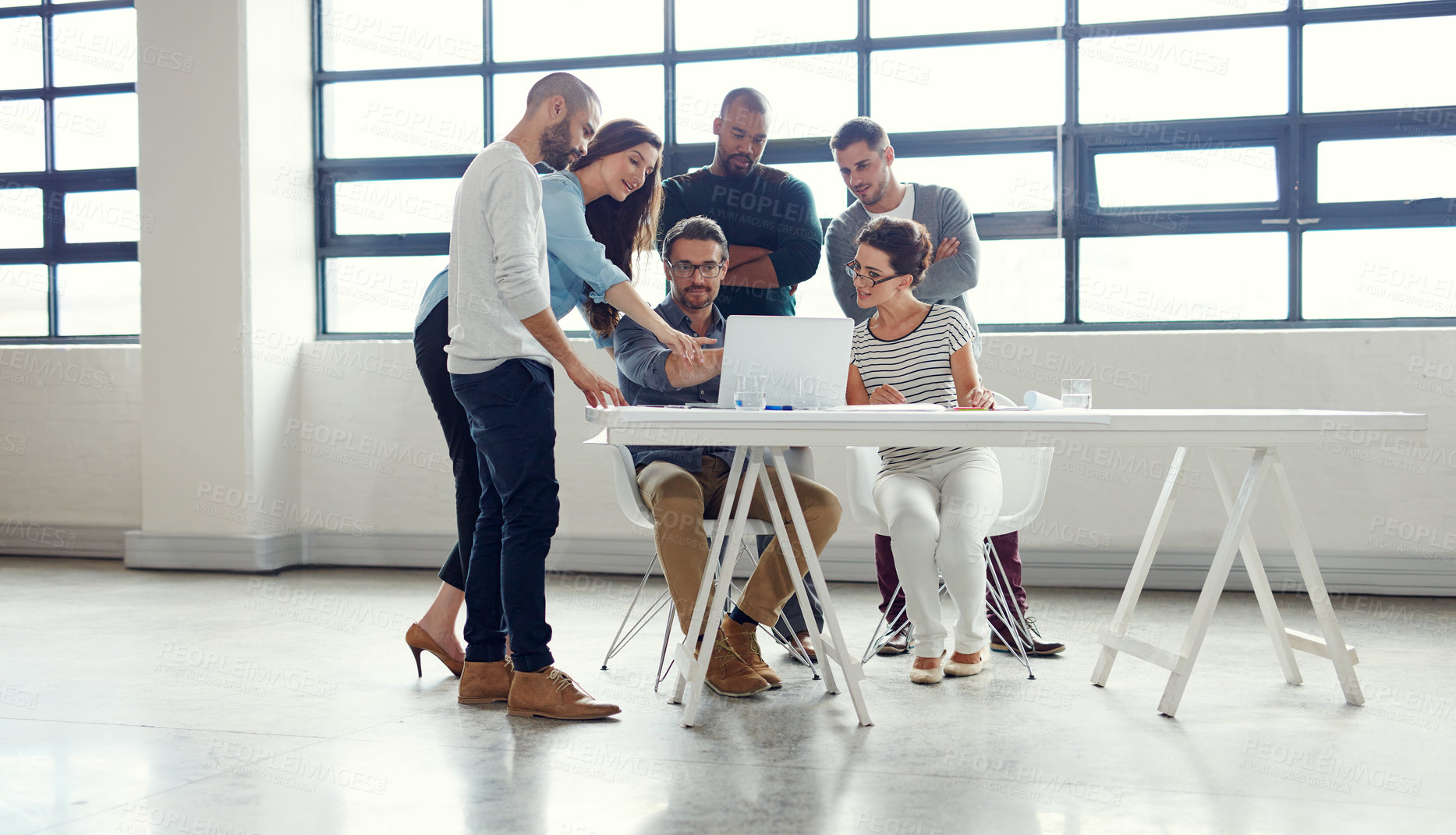 Buy stock photo Shot of a group of coworkers having a meeting in an open plan office