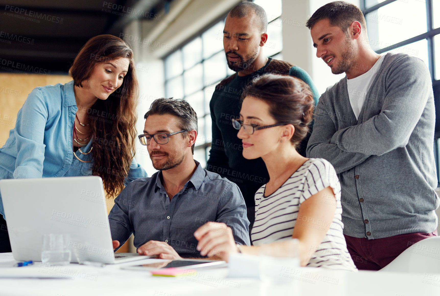 Buy stock photo Shot of a group of coworkers having a meeting in an open plan office