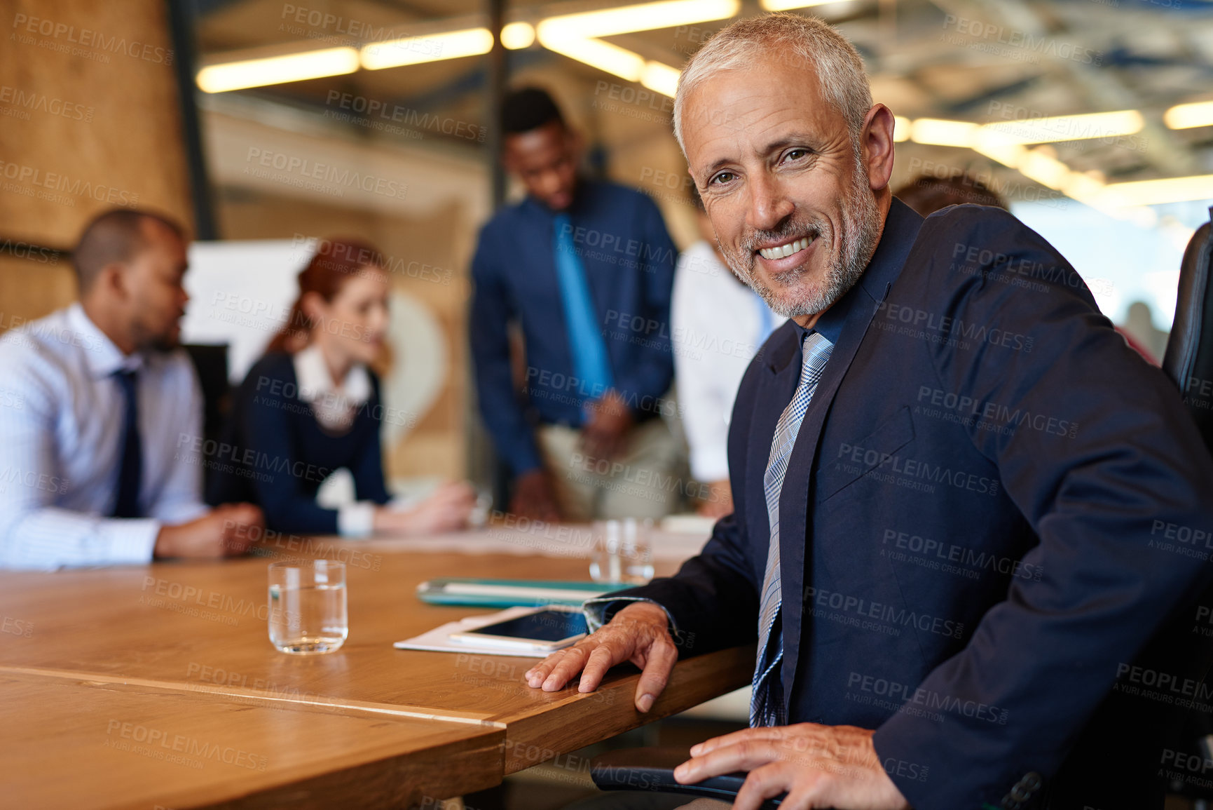 Buy stock photo Mature, smile or portrait of businessman in meeting for brainstorming, teamwork or collaboration for project. Happy, proud or face of confident developer in group for discussion or feedback in office