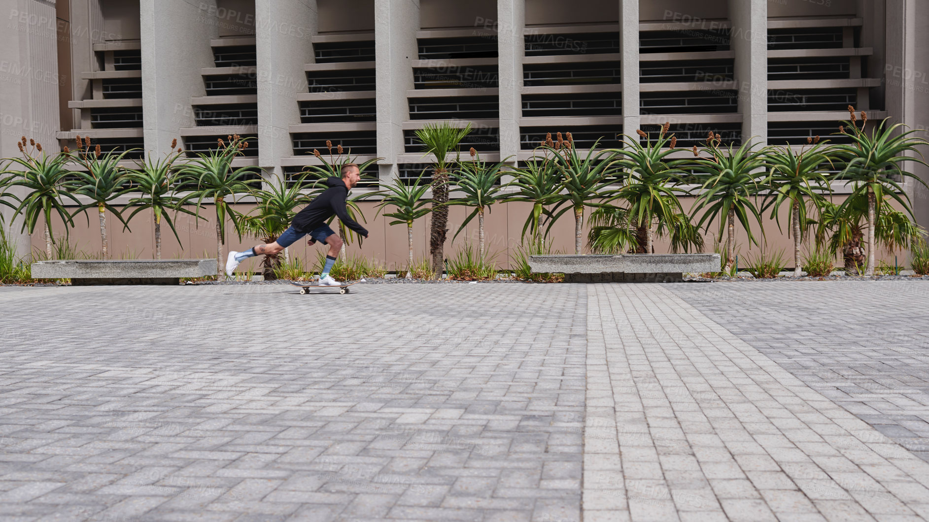 Buy stock photo Shot of skateboarders in the city