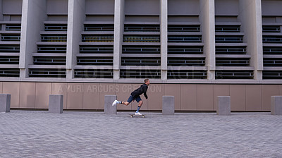 Buy stock photo Shot of skateboarders in the city