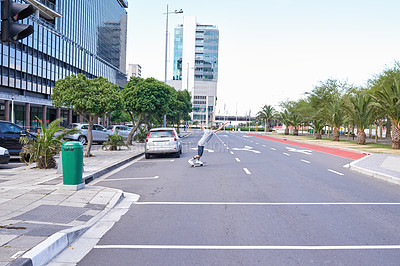 Buy stock photo Shot of skateboarders in the city