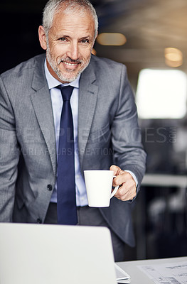 Buy stock photo Cropped portrait of a mature businessman drinking coffee in his office