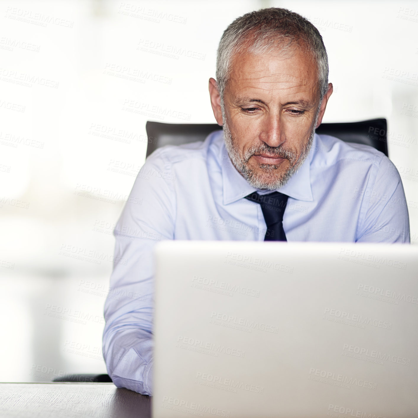 Buy stock photo Laptop, typing and mature businessman at desk with thinking, research and director networking at law firm. Legal consultant, lawyer or man in office with computer for email, report and online support