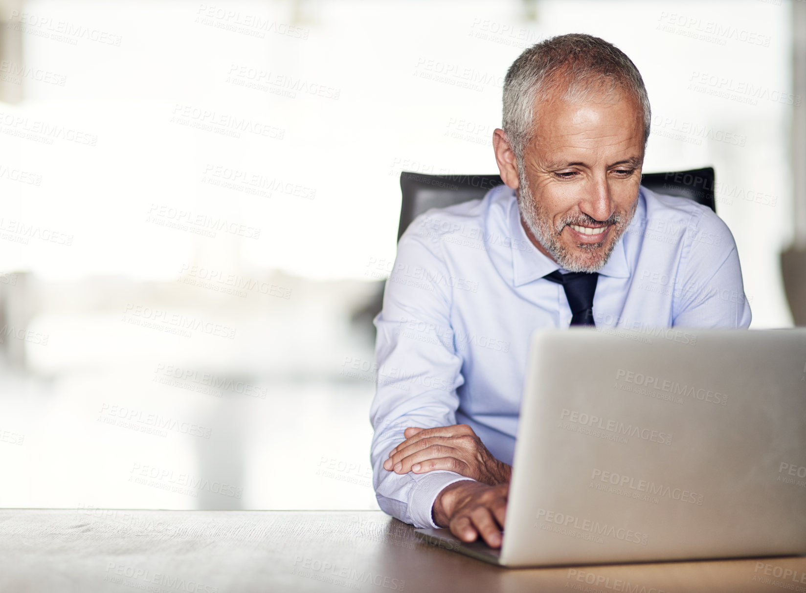 Buy stock photo Laptop, research and mature man at desk with thinking, typing and director networking at law firm. Legal consultant, lawyer or happy businessman in office with computer for email, report and review