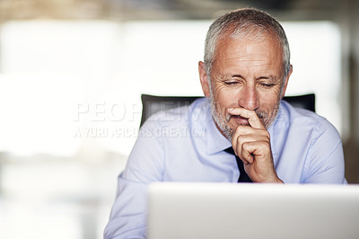 Buy stock photo Cropped shot of a mature businessman working in his office