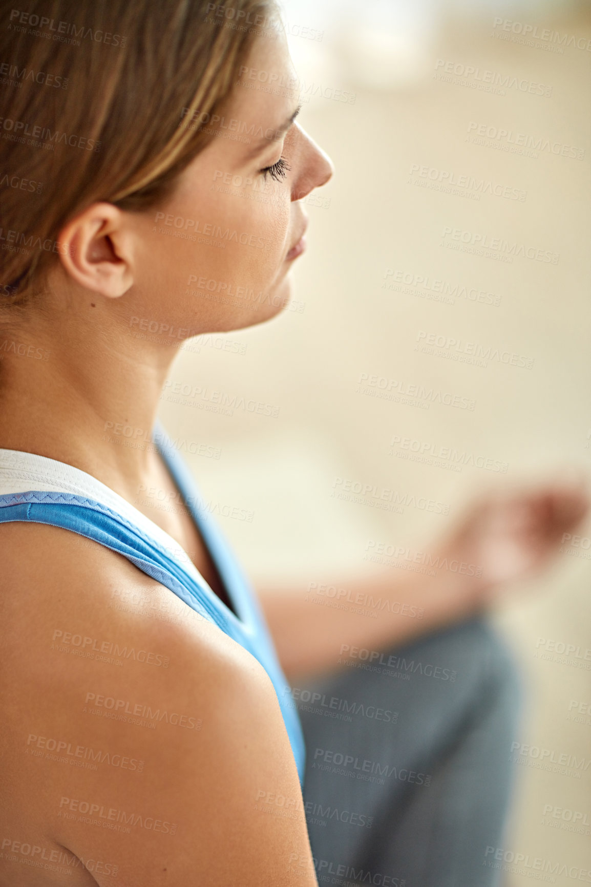 Buy stock photo Cropped shot of a woman meditating indoors