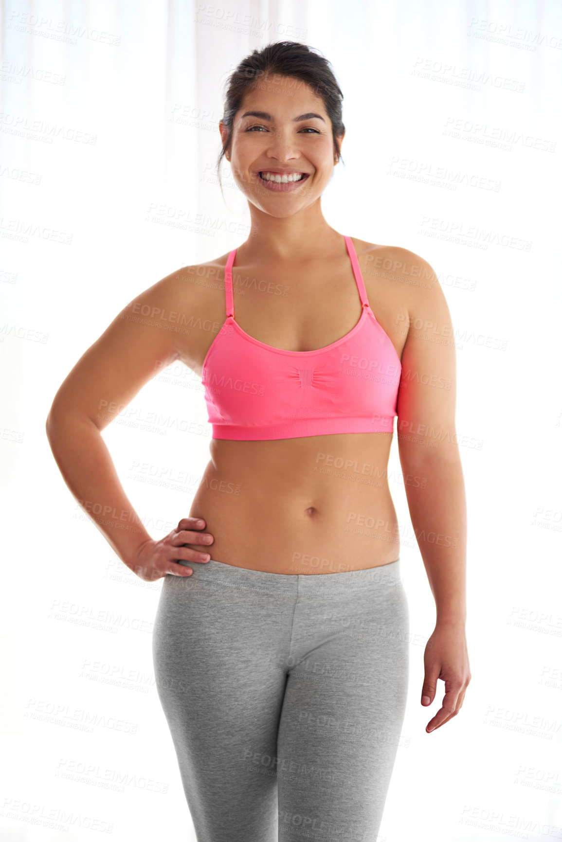 Buy stock photo Cropped shot of a young woman in exercise clothing against a white background