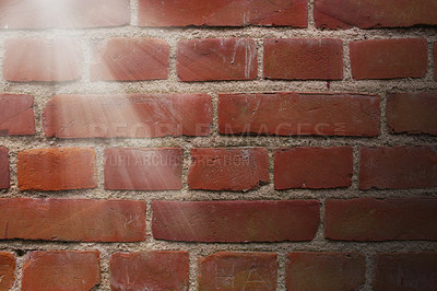 Buy stock photo Outdoor, brick wall and sunshine on surface of home, house or city building with pattern or texture. Exterior, detail background, closeup of rough architecture or construction design on old structure