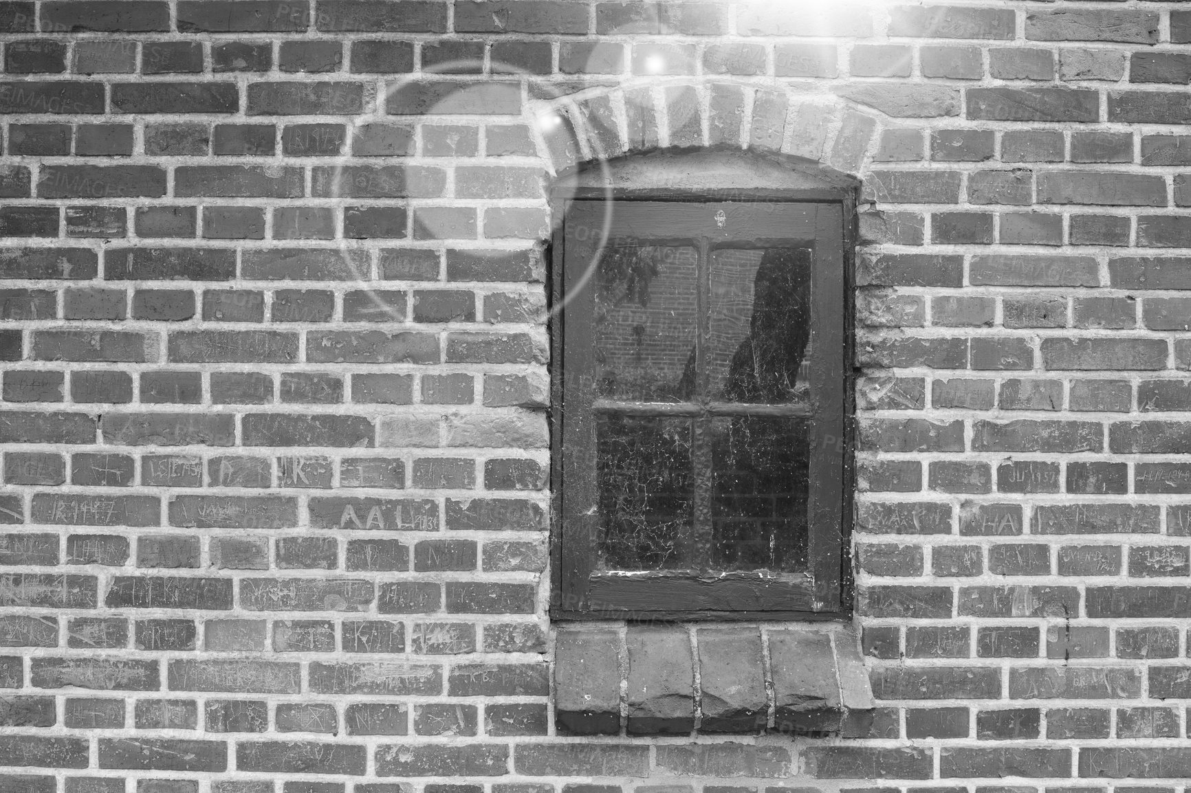 Buy stock photo Brick wall, black and white or window of house, home or city building with pattern, light or texture. Monochrome style, architecture exterior or traditional construction design on firm old structure